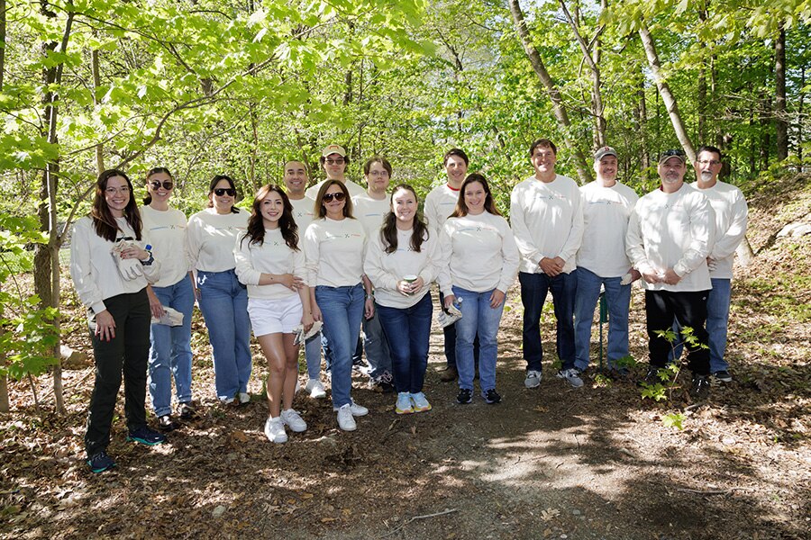 Staples employees plant trees in their local community